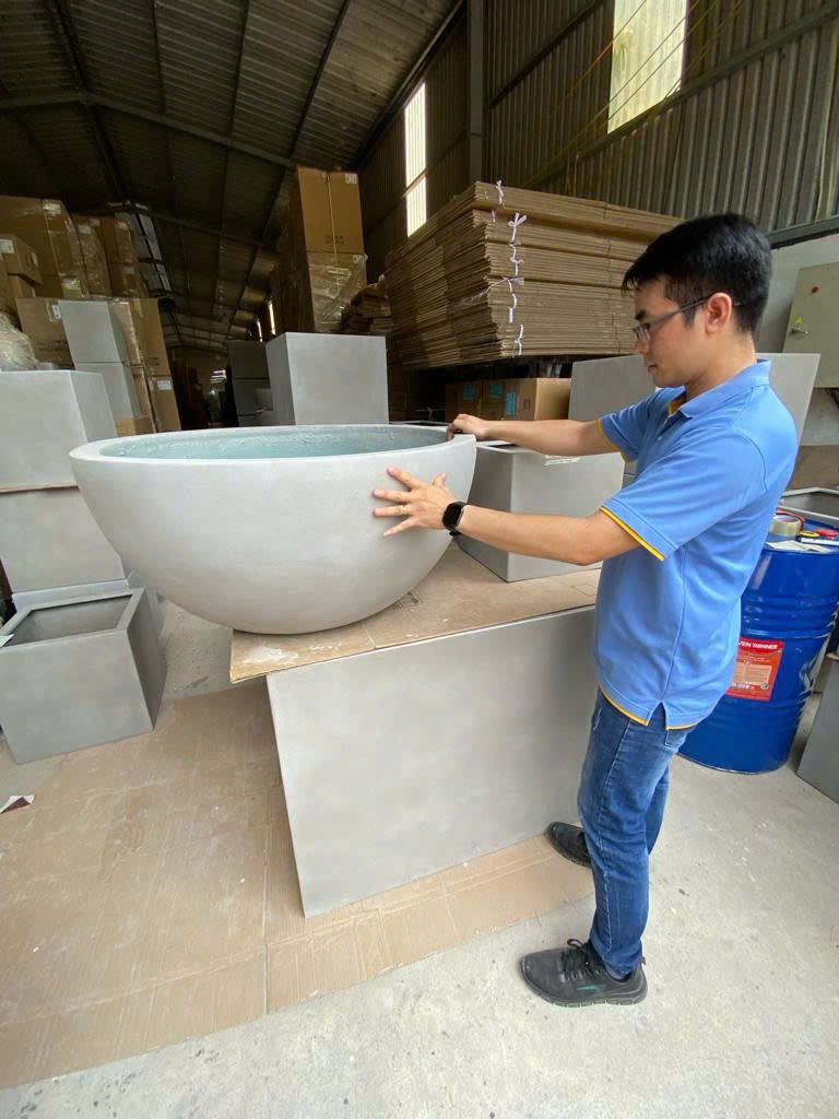 Checking a planter bowl before packing